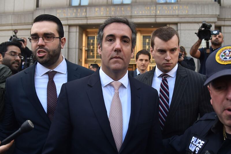 (FILES) In this file photo taken on April 26, 2018 US President Donald Trump's personal lawyer Michael Cohen(C) leaves the US Courthouse in New York on April 26, 2018. As Donald Trump's longtime personal attorney, Michael Cohen earned a reputation as the "fixer" for the Manhattan real estate tycoon and a pit bull defender of his larger-than-life boss. The brash 51-year-old New Yorker -- who once boasted of his office in Trump Tower -- is now in a fix of his own, under criminal investigation and accused of seeking to cash in on his access to the president.His home and office have been raided by the FBI, and Cohen is being lampooned by comedians as a real-life version of the sleazy ambulance-chasing lawyer Saul Goodman on the hit show "Breaking Bad."
 / AFP / HECTOR RETAMAL
