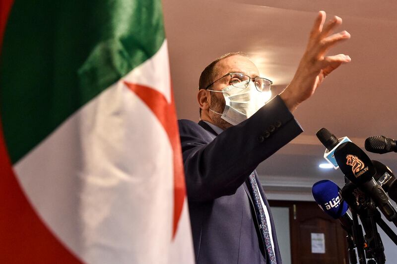 Abderrezak Mokri, leader of Algeria's Movement of Society for Peace, speaks wearing a face mask during a press conference at the party's headquarters in the capital Algiers.  AFP
