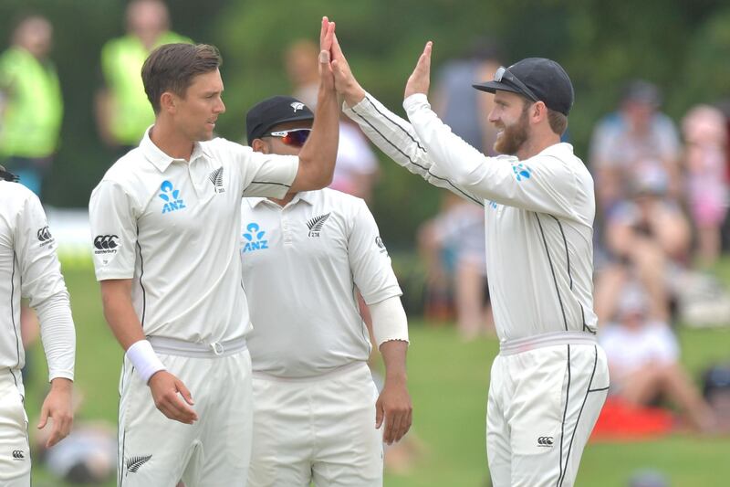 New Zealand's Trent Boult (L) celebrates with captain Kane Williamson after their series win over Sri Lanka during day five of the second cricket Test match between New Zealand and Sri Lanka at Hagley Park Oval in Christchurch on December 30, 2018. / AFP / Marty MELVILLE
