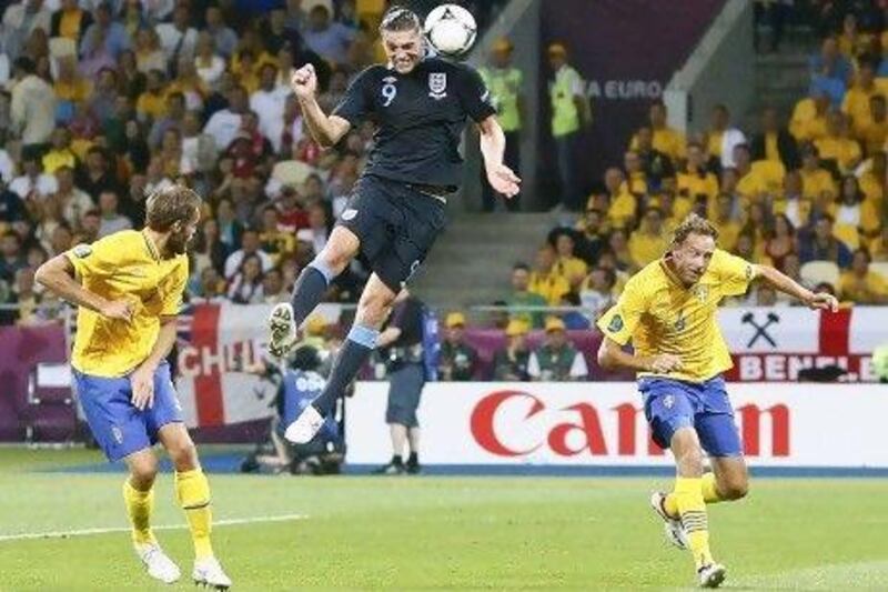 Andy Carroll scores the opener for England against Sweden at the Olympic Stadium in Kiev last night.