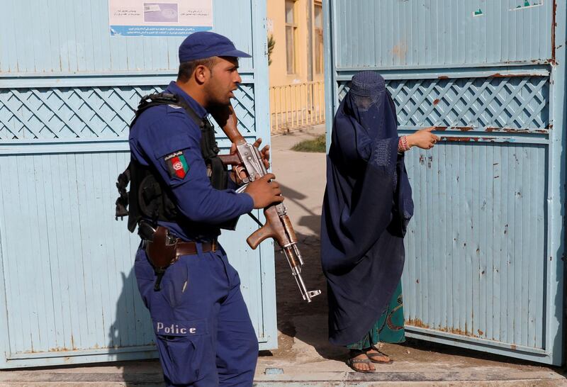 An Afghan woman arrives at a polling station to cast her vote during parliamentary elections in Kabul, Afghanistan. Reuters