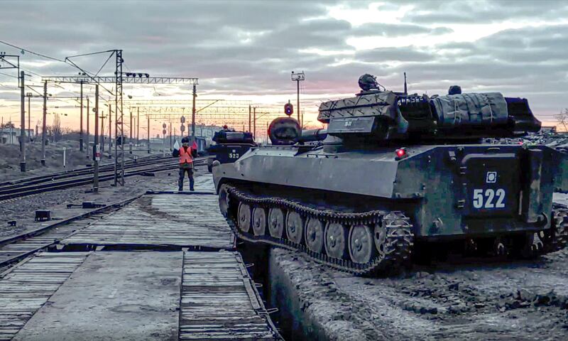 Russian armoured vehicles are loaded on to railway platforms after the end of military drills in southern Russia. AP