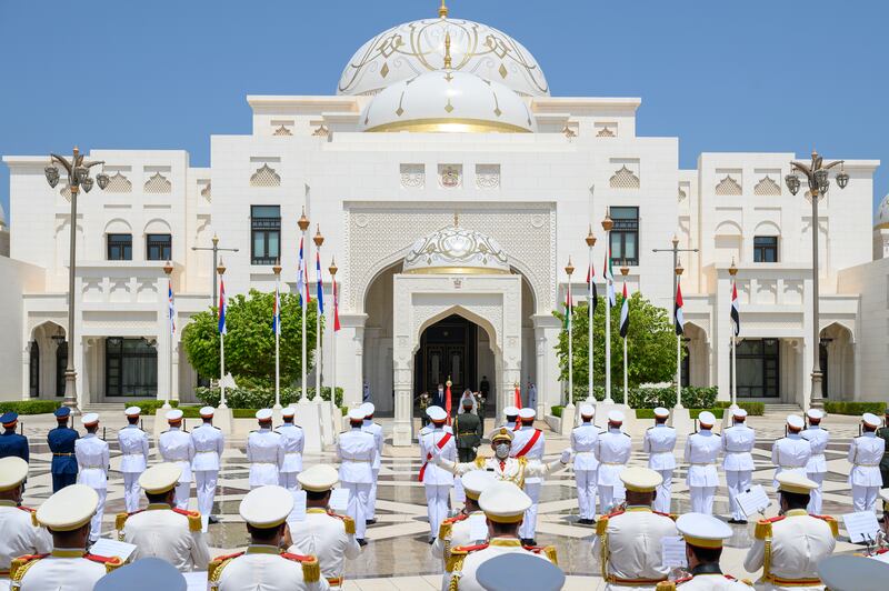 The national anthems of the UAE and Serbia play.