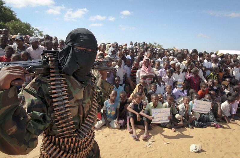 An armed member of the Al Shabab extremist group at a rally on the outskirts of Mogadishu, Somalia. AP