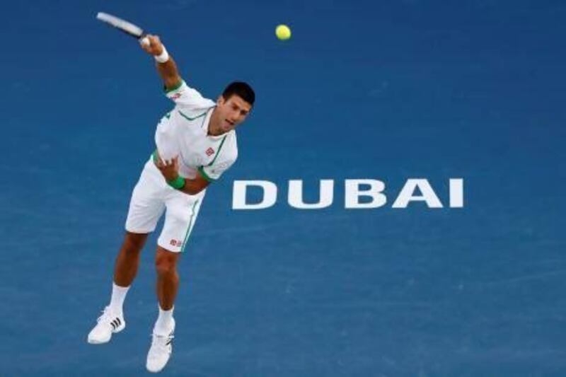 Novak Djokovic of Serbia serves to Juan Martin Del Potro.