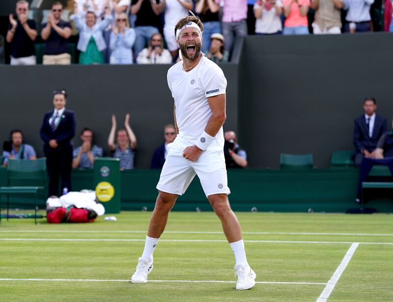 Britain's Liam Broady celebrates after beating Argentina's Diego Schwartzman in their second-round singles match. AP