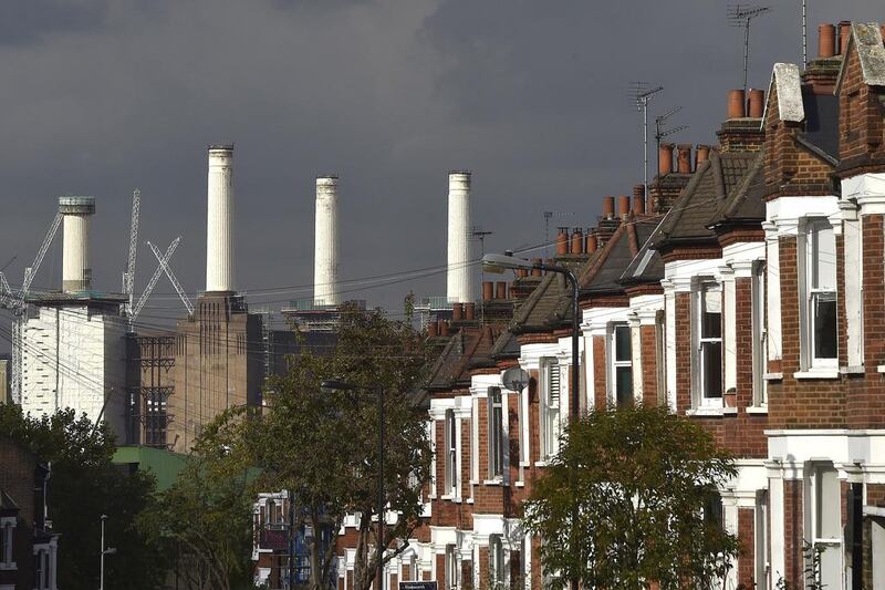 A rig surrounds the top of one of the chimney. Toby Melville / Reuters