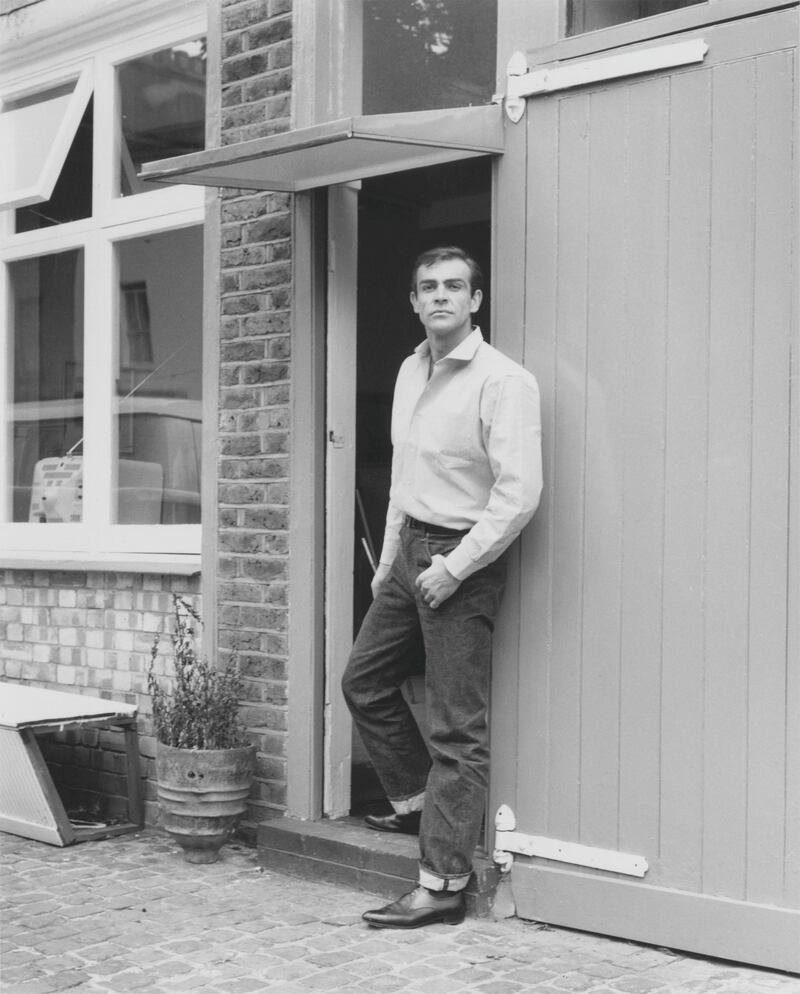 Scottish actor Sean Connery, the new face of James Bond, leaves his basement flat in London's NW8, 31st August 1962. (Photo by Chris Ware/Keystone Features/Hulton Archive/Getty Images)