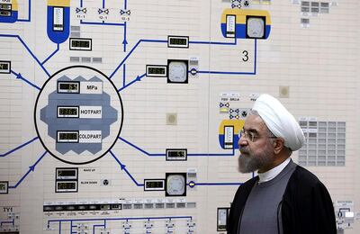 FILE - In this Jan. 13, 2015, file photo released by the Iranian President's Office, President Hassan Rouhani visits the Bushehr nuclear power plant just outside of Bushehr, Iran. Iran announced Sunday, July 7, 2019 it will raise its enrichment of uranium, breaking another limit of its faltering 2015 nuclear deal with world powers and further heightening tensions between Tehran and the U.S. (AP Photo/Iranian Presidency Office, Mohammad Berno, File)