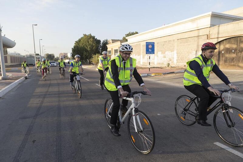 Department of Transport employees set off to cycle to work. Antonie Robertson / The National