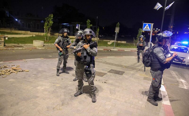 Israeli security forces stationed on a street in Lod. AFP