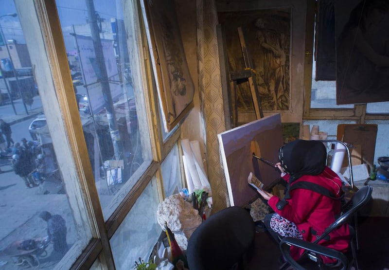A woman paints at a private art institute in Kabul.