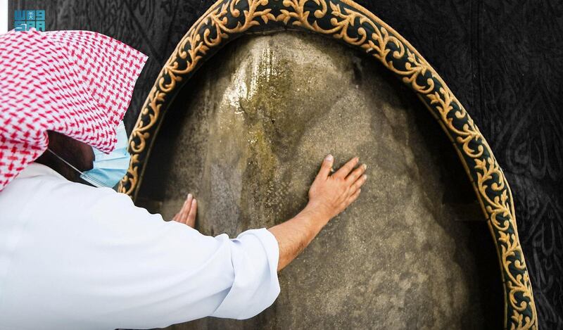 An official from the General Presidency for the Affairs of the Two Holy Mosques cleans the Kabaa at the Grand Mosque, in Makkah, Saudi Arabia. Reuters