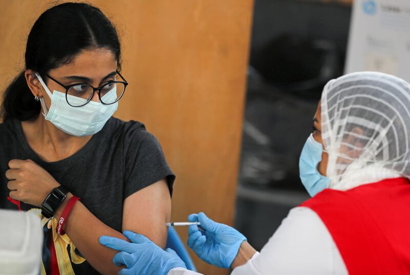A woman receives a Covid-19 vaccine at one of the youth centres in Cairo. Photo: Reuters