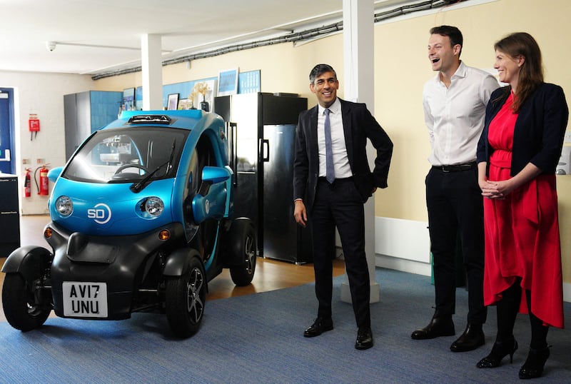 Britain's Prime Minister Rishi Sunak with Wayve Technologies co-founder and chief executive Alex Kendall alongside an autonomous car in London. AFP