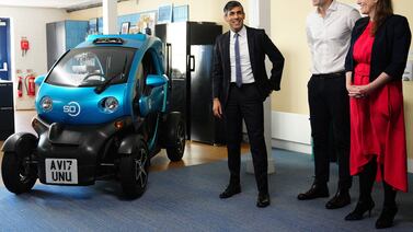 Britain's Prime Minister Rishi Sunak with Wayve Technologies co-founder and chief executive Alex Kendall alongside an autonomous car in London. AFP