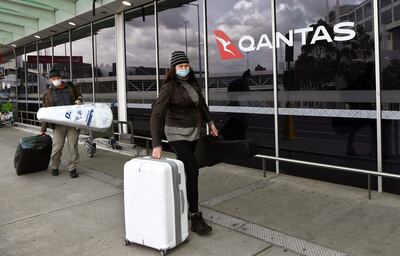 Travellers arriving at a deserted Qantas terminal at Melbourne Airport in August 2021. AFP