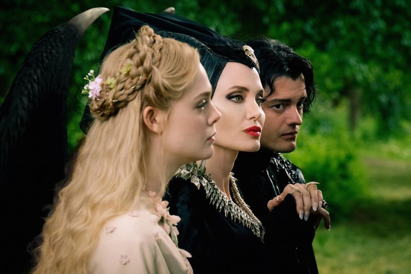 Elle Fanning is Aurora, Angelina Jolie is Maleficent and Sam Riley is Diaval in Disney’s live-action MALEFICENT:  MISTRESS OF EVIL