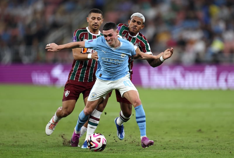 Phil Foden of Manchester City is challenged by John Kennedy of Fluminense during the FIFA Club World Cup final. Getty Images