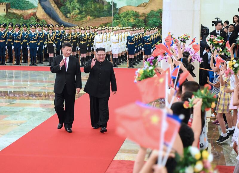 Kim Jong-un declared North Korea's unstinting "friendship, unity and cooperation" with Beijing during his visit. Shen Hong / Xinhua via AP