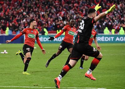 Rennes' players celebrate after Paris Saint-Germain's French midfielder Christopher Nkunku failed to score during the penalty shout-out of the French Cup final football match between Rennes (SRFC) and Paris Saint-Germain (PSG), on April 27, 2019 at the Stade de France in Saint-Denis, outside Paris. / AFP / Anne-Christine POUJOULAT
