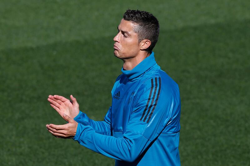 Cristiano Ronaldo takes part in training ahead of Real Madrid's Uefa Champions League group opener against Apoel Nicosia. Paul White / AP Photo