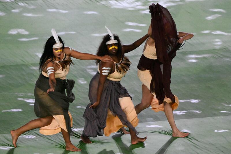 Members of the Tjarutja Dance Theatre Collective take part in the opening ceremony. AFP