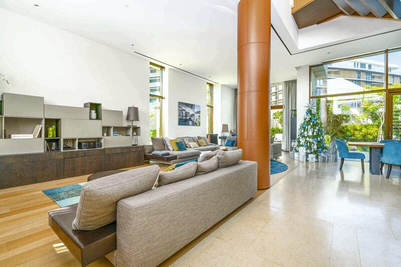 A big brown pillar dominates the lounge. Courtesy LuxuryProperty.com