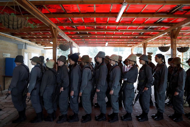 Israeli border policewomen queue as they wait to vote at a base in Beit Horon settlement. Reuters