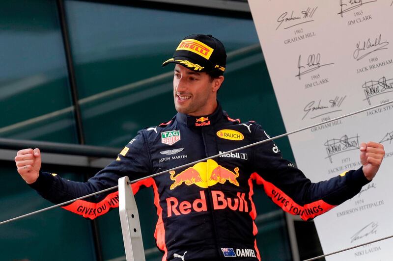 Red Bull driver Daniel Ricciardo of Australia celebrates on the podium after winning the Chinese Formula One Grand Prix at the Shanghai International Circuit in Shanghai, Sunday, April 15, 2018. (AP Photo/Andy Wong)