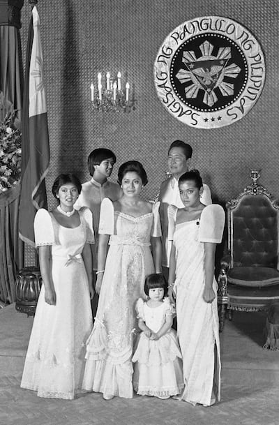 Ferdinand Marcos Sr, back right, and his wife Imelda pose with their children and a niece, for an official portrait after his third-term inauguration in 1981, in Manila. Ferdinand Marcos Jr is pictured back left. AP 