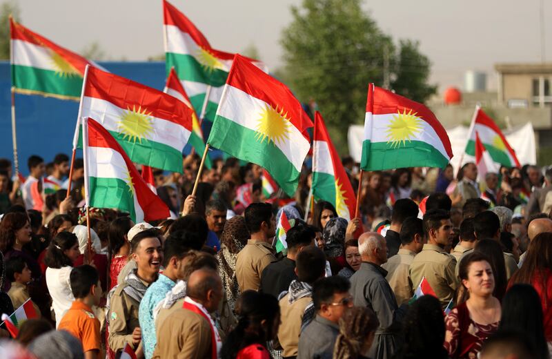 Iranian Kurds hold Kurdish flags as they take part in a gathering to urge people to vote in the upcoming independence referendum in the town of Bahirka, north of Arbil, the capital of the autonomous Kurdish region of northern Iraq, on September 21, 2017.
The controversial referendum on independence for Iraqi Kurdistan is set for September 25. / AFP PHOTO / SAFIN HAMED