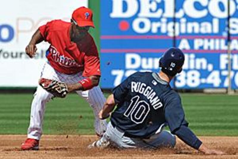 Justin Ruggiano, right, of the Tampa Bay Rays slides into second base ahead of a throw to shortstop Jimmy Rollins of the Philadelphia Phillies during the Phillies 12-5 win.
