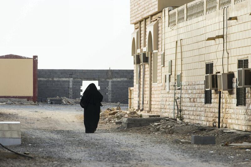 ShaÕam, United Arab Emirates, November 22, 2017:     A woman walks through the streets in ShaÕam village, in northern Ras al Khamiah on November 22, 2017. Christopher Pike / The National

Reporter: Anna Zacharias
Section: News