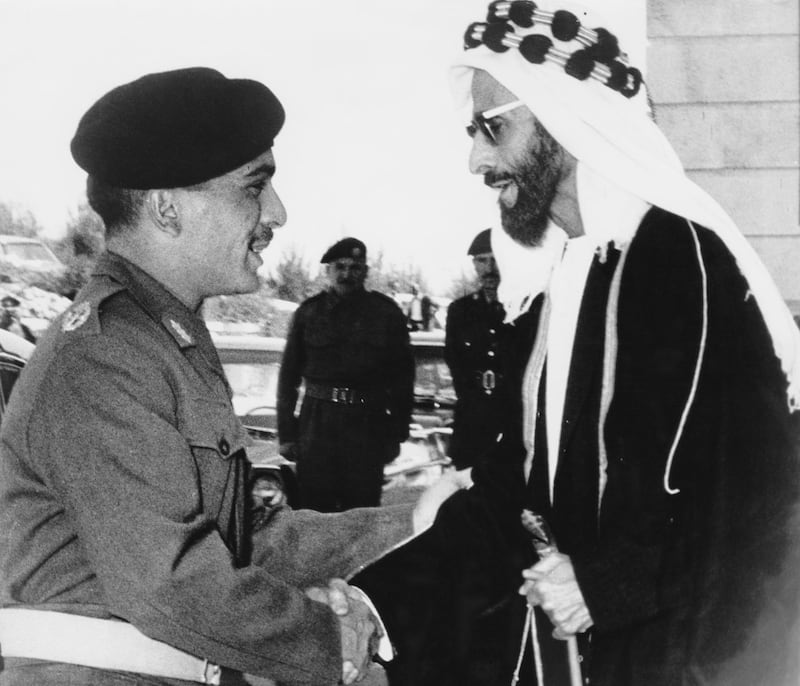 King Hussein of Jordan (1935 - 1999) greets Sheikh Shakhbut bin Sultan Al Nahyan (right), the ruler of Abu Dhabi, upon his arrival at the Officers' Club in Zerqa, Jordan, April 1966. The Sheikh had recently announced that he would donate 200,000 pounds toward the rebuilding of Maan, a city in Jordan devastated by flash floods. (Photo by Keystone/Hulton Archive/Getty Images)