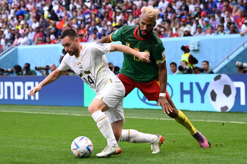 Serbia's Andrija Zivkovic controls the ball against Eric Maxim Choupo-Moting of Cameroon. Getty