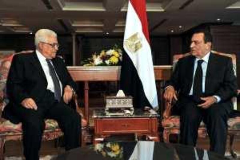 In this photo released by the Palestinian Authority, Egypt's President Hosni Mubarak, right, and Palestinian President Mahmoud Abbas,  meet at the Red Sea resort of Sharm el-Sheik, Egypt, Monday, Jan. 4, 2010. The Palestinian president stuck by his demand Monday for a complete halt in West Bank settlement building before resuming peace talks with Israel. (AP Photo/Palestinian Authority, Omar Rashidi, HO) ** NO SALES ** *** Local Caption ***  JRL115_MIDEAST_PALESTINIANS_EGYPT.jpg *** Local Caption ***  JRL115_MIDEAST_PALESTINIANS_EGYPT.jpg