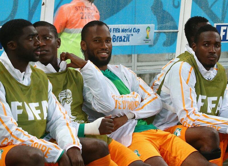 Didier Drogba of the Ivory Coast looks on from the bench during his side's 2014 World Cup Group C match against Japan on Saturday. He came in as a reserve later in the game. Mark Kolbe / Getty Images / June 14, 2014 