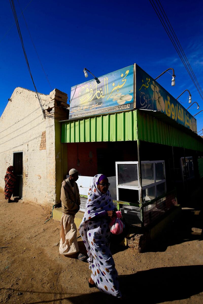 Sudanese people buy bread at a bakery in the town of Atbara, an industrial town 350 kilometres northeast of Sudan’s capital Khartoum. AFP