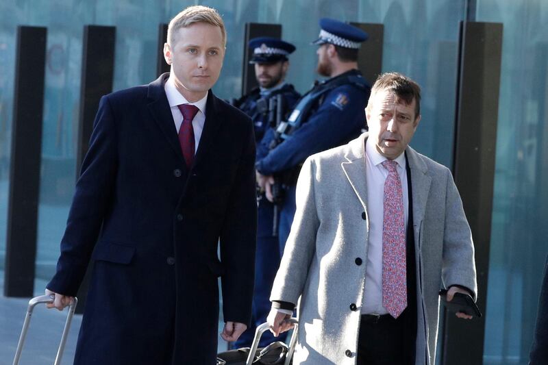 FILE - In this Aug. 15, 2019, file photo, Jonathan Hudson, left, and Shane Tait, defense lawyers for Brenton Tarrant, arrive at the Christchurch District Court in Christchurch, New Zealand. Tarrant who has admitting killing 51 worshippers in a mass shooting at two mosques in Christchurch on March 15, 2019 has dismissed his legal team and will represent himself at a sentencing hearing next month. Tarrantâ€™s sentencing hearing, delayed by the coronavirus pandemic, will begin in Christchurch on Aug. 24, 2020 and could last more than three days.  (AP Photo/Mark Baker, File)