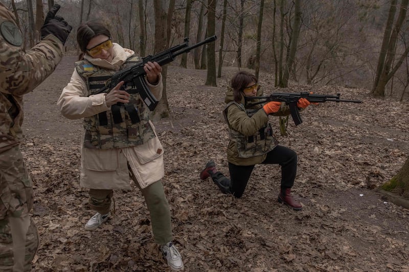 Ukrainian civilian women are trained to use weapons, in Kyiv. AFP