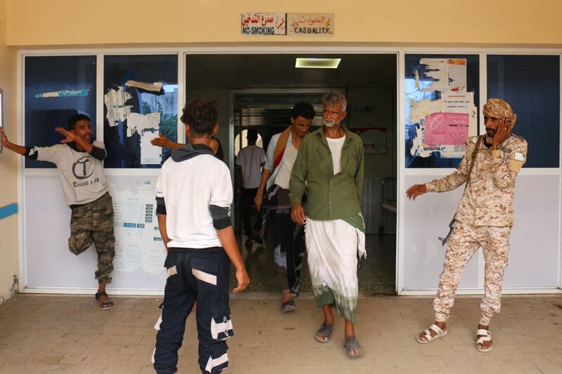 Relatives wait for news on casualties after Houthi missiles  struck Al Anad airbase, at the Ibn Khaldun hospital in Yemen's government-held southern province of Lahij. AFP