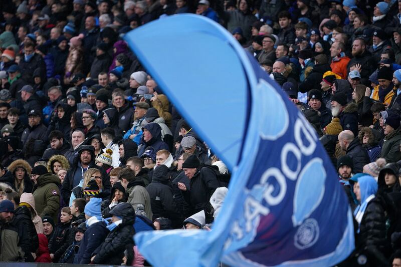 Fans wait for the start of an English FA Cup fourth round soccer match between Manchester City and Fulham at the Etihad Stadium in Manchester, England, Saturday, Feb.  5, 2022.  (AP Photo / Jon Super)