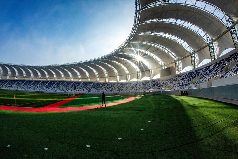 Finishing touches are made to the stadium ahead of a friendly match between Iraqi's Al-Minaa and Kuwait SC.  