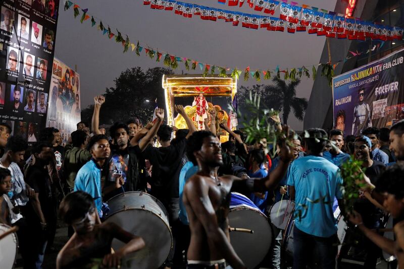 Fans take part in a procession. Reuters