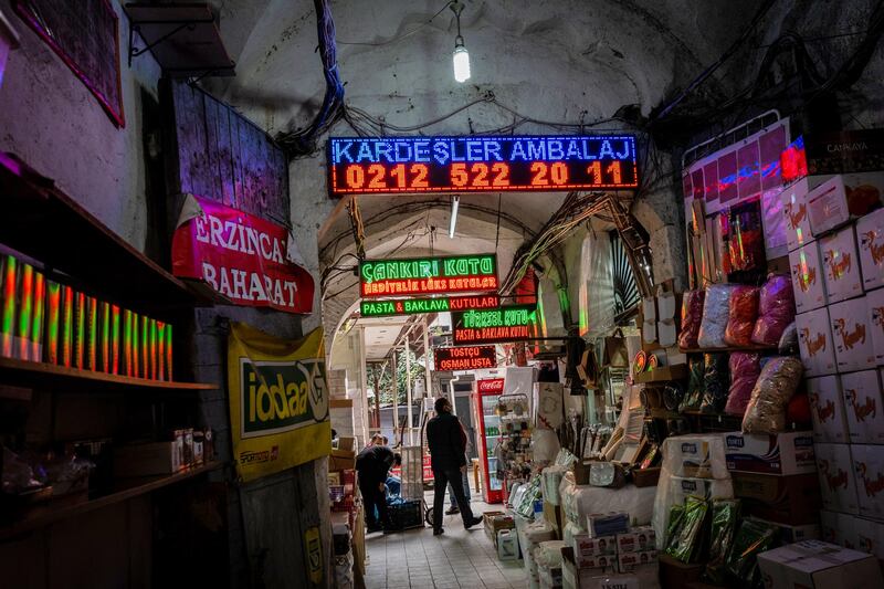 Illuminated signs for restaurants and shops in an alleyway in a commercial district of Istanbul, Turkey. Bloomberg