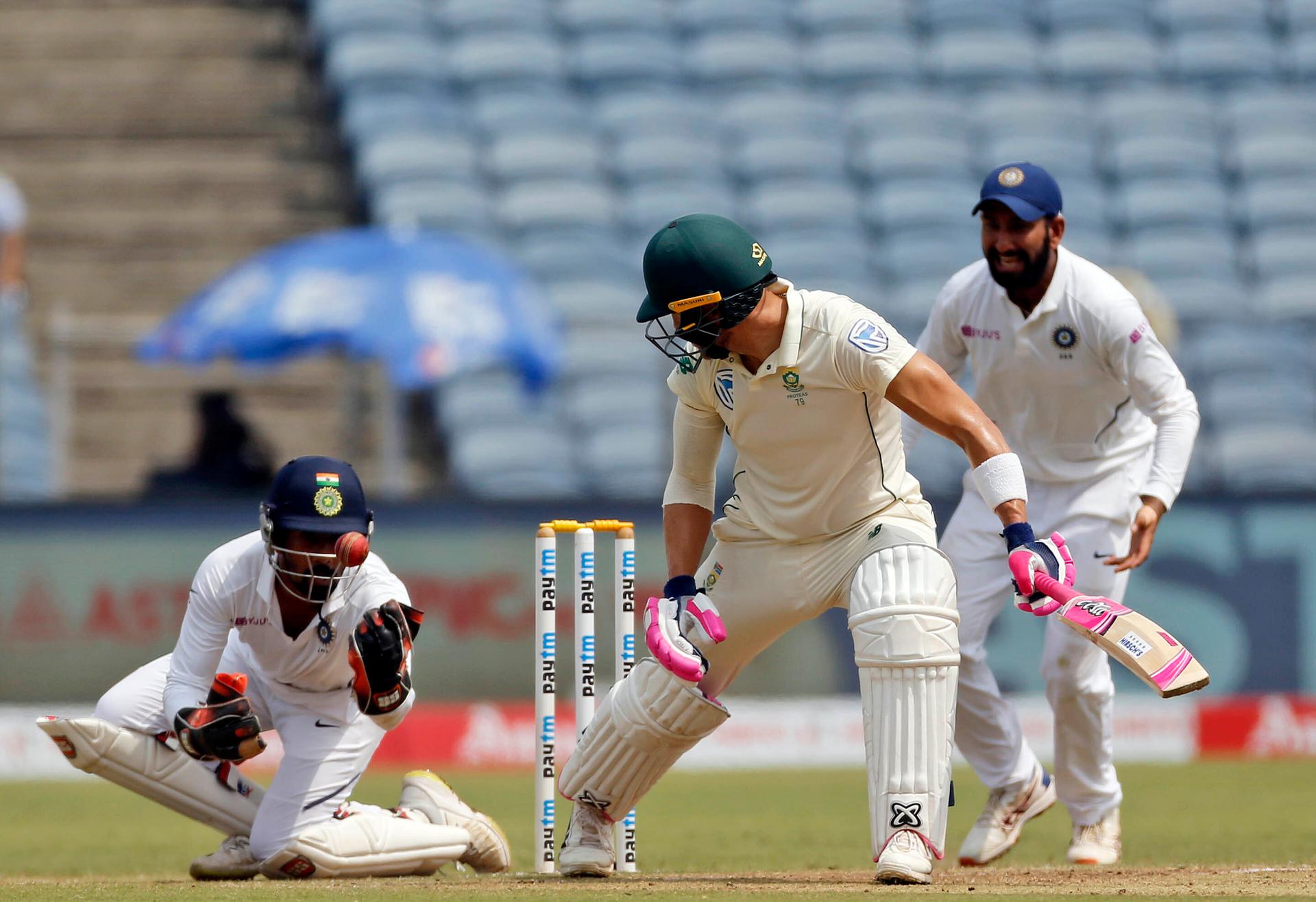 India's cricket team wicket keeper Wriddhiman Saha takes a catch of Faf du Plessis during fourth day of second cricket test match between India and South Africa in Pune, India, Sunday, Oct. 13, 2019. (AP Photo/Rajanish Kakade)