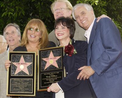 From left, Henry Winkler, Penny Marshall, Cindy Williams, Ed Begley Jr and Garry Marshall, at a rare two-star unveiling ceremony honouring the two actresses on the Hollywood Walk of Fame on August 12, 2004. Reuters