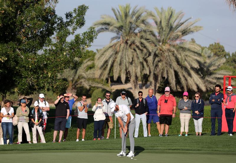 Abu Dhabi, United Arab Emirates - January 18th, 2018: Golfer Dustin Johnson putts at the Abu Dhabi HSBC Championship. Thursday, January 18th, 2018 at Abu Dhabi Golf Club, Abu Dhabi. Chris Whiteoak / The National