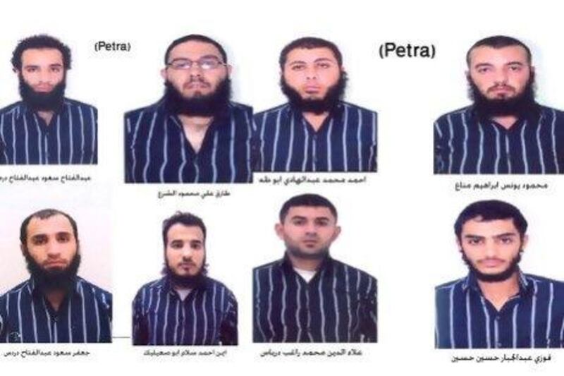 A handout picture released by the Jordanian news agency Petra  shows a combo of portraits of eight of 11 suspected members of a group believed to be linked to Al Qaeda who have been arrested in Jordan.